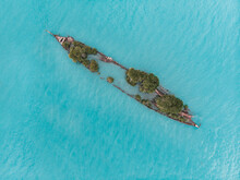 Aerial View Of A Shipwreck With Trees Gowing On It, Located Off The Coast On Magnetic Island,  Queensland, Australia