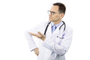 Wall Mural - Serious senior age doctor in medical uniform and eyeglasses pointing at empty text space isolated on white background. Health, healthcare, insurance and medicine clinic ads concept