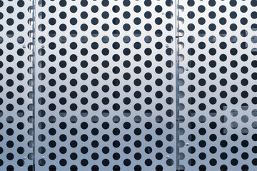 Perforated stainless steel sheet, iron plate for industrial background.