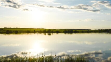 Wall Mural - Timelapse of the sunset over the lake in fine summer weather