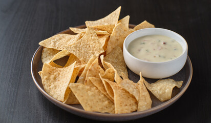 Wall Mural - mexican hot queso blanco cheese dip with corn tortilla chips on plate
