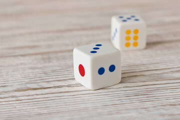 Dice on a wooden table. Close up. The concept of good luck in gambling.