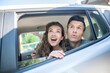 © zinkevych - Man and woman looking out of a car window