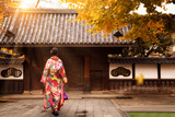 Fototapeta  - Young asian girl walking and wearing kimono