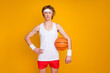 © deagreez - Portrait of his he nice attractive slim funky content serious guy sportsman holding in hand orange ball isolated over bright vivid shine vibrant yellow color background