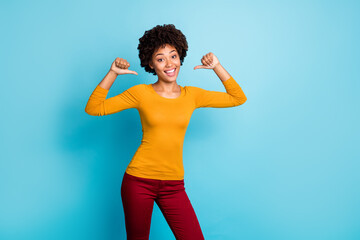 Sticker - I am best. Cheerful candid afro american girl point herself with index finger enjoy her personality wear stylish trendy red pants trousers isolated over blue color background