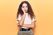 © Krakenimages.com - Beautiful kid girl with curly hair wearing casual clothes thinking looking tired and bored with depression problems with crossed arms.