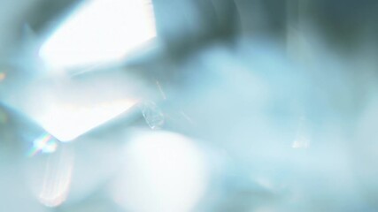 Wall Mural - Sun Glare in the Heavenly Surroundings. Loop. The light passes through the facets of a slowly rotating diamond and creates repetitive sparkling highlights and rainbow colors