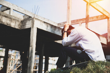 Asian businessman professional failed or upset with hand on head. Image of Stressed businessman concept.