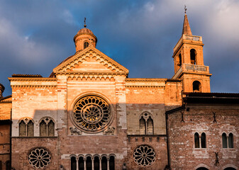 Wall Mural - Italy, Foligno, medieval cathedral front view, lights of sunset