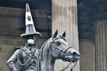 Glasgow / Scotland - June 9 2020: Duke Of Wellington Statue In Glasgow Wearing Black Lives Matter Cone And PPE Protective Mask Amid Black Lives Matter Protest And Coronavirus Pandemic
