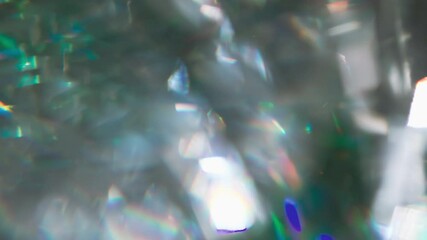 Wall Mural - Emerald Gemstone Overflows. Loop. The light passes through the facets of a slowly rotating diamond and creates repetitive sparkling highlights and rainbow colors