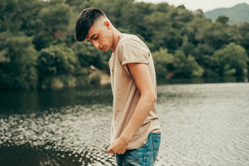 Young boy model on a lake.