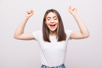 Sticker - Portrait of a an excited young woman celebrating success over a white background