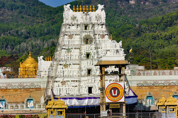 View of Tower, with carvings of Hindu Deities at entrance to Temple dedicated to  Lord Balaji, at Tirumala, Andhra Pradesh, India. This famous Hindu Temple attracts thousands of pilgrims everyday.