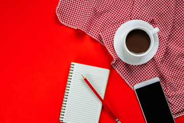 Wall Mural - Background of red with smartphone, notebook and a cup of coffee