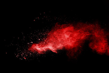 Wall Mural - launched red powder on white background.