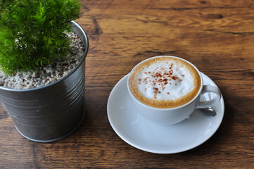 Wall Mural - Coffee cup in coffee shop