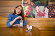 © koloyar83 - A girl is drinking coffee in a coffee house.