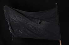 Old Black Flag On A Black Background