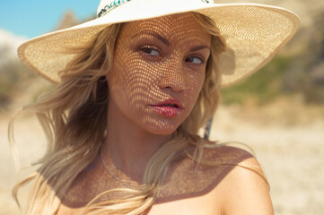 Wall Mural - Beautiful slender blonde at the sea. Summer travel photos.