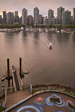 False Creek Yaletown Ferry. A Commuter Ferry Approaching A Dock In False Creek. Vancouver, British Columbia, Canada.

