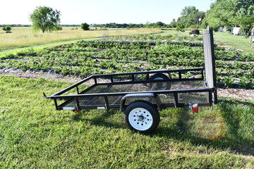 Sticker - Cargo Trailer by a Garden