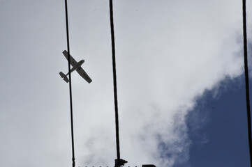 propeller plane flying around the neighbourhood practicing in the morning.