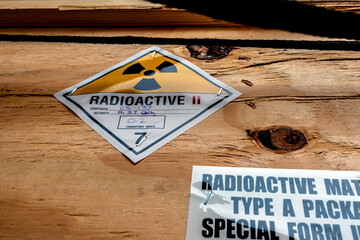 Poster - Radiation label beside the transport wooden box Type A package