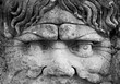sixteenth century era statue of a man with open mouth and curly hair in the village of Bomarzo close to Rome 