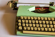 An old green mechanical typewriter
