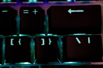 Wall Mural - Closeup shot of an illuminated computer keyboard