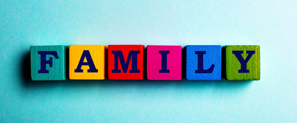 the word family is made up of multi-colored cubes on a blue background