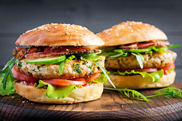Wall Mural - Big sandwich - hamburger burger with turkey meat,  tomato,  bacon and lettuce.