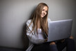 © lightpoet - Pretty, young woman with her laptop studying for an exam/working