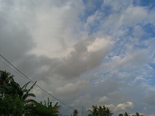 Wall Mural - Blue sky background with white clouds