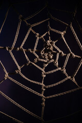Wall Mural - Japanese traditional technique of knitting shibari ropes in the form of a spider web. No people. Part of the bedroom interior. BDSM.