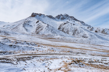 Wall Mural - the gravel road on the snow mountain