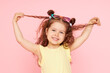 © oes - Portrait of a happy child. Cute little girl with a funny face on a pink background. Advertising baby products