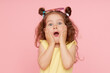 © oes - Portrait of a happy child. Cute little girl with a funny face on a pink background. Advertising baby products