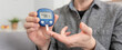 © Proxima Studio - Young man measures blood sugar level.
