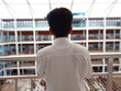 © Glaide - Rear view of a man in a shopping college