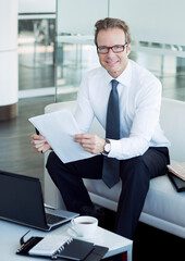 Wall Mural - Businessman working in office lobby