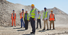 Business People And Workers Standing In Quarry
