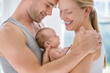 © Tom Merton/KOTO - Parents cradling newborn baby