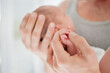 © Tom Merton/KOTO - Mother cradling newborn baby's hand