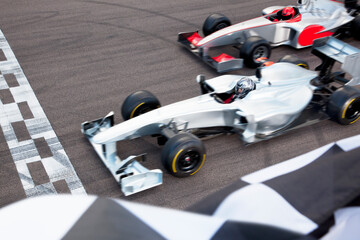 Race cars at finish line on track