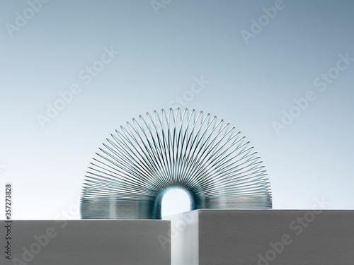 Cuadros en Lienzo Metal slinky spanning space between blocks