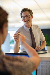 business people exchanging cards in office