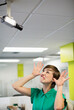 © Paul Bradbury/KOTO - Businesswoman making face at security camera